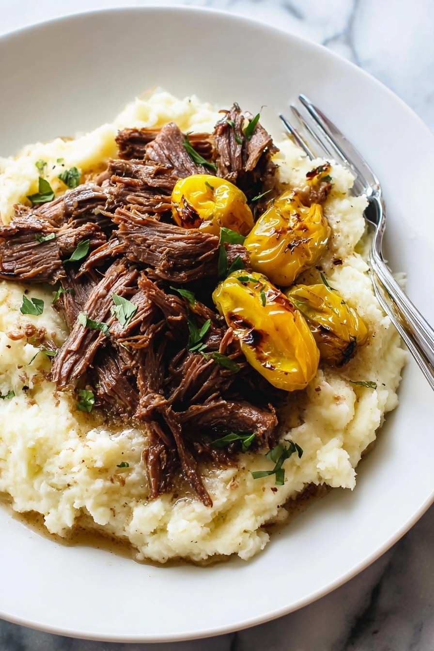 Mississippi Pot Roast - The image shows a white bowl filled with shredded dark brown meat scattered with small green herb pieces on top. On one side of the bowl, there are four charred yellow peppers with a slightly wrinkled texture. The bowl rests on a white marbled surface with a silver fork with a wooden handle placed near the top right edge. The meat looks tender and juicy, with strands clumped together, and the herbs add a fresh touch. photo taken with an iphone --ar 2:3 --v 7