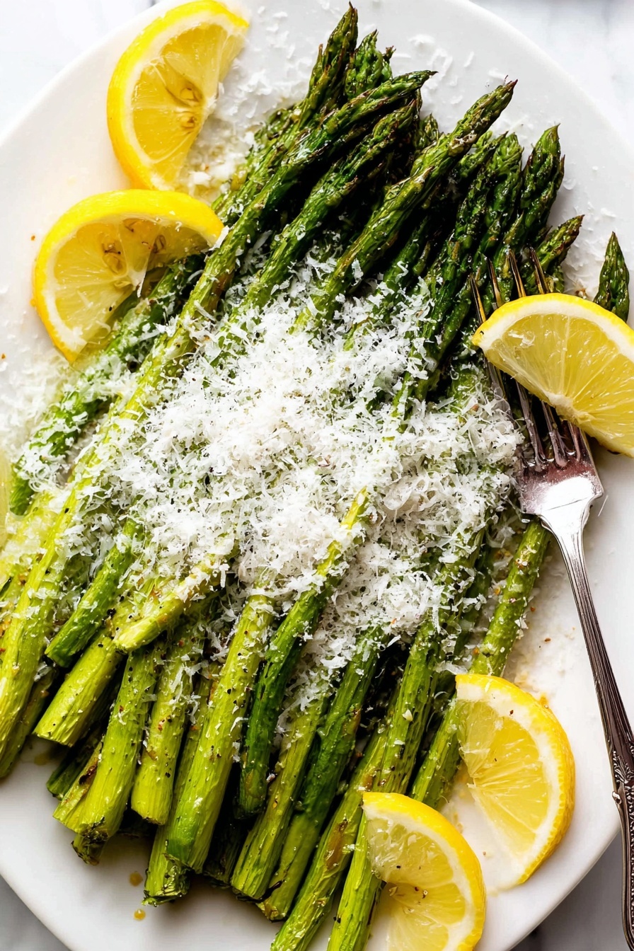 The dish shows a white plate full of green roasted asparagus stalks placed in a neat pile that covers most of the plate. On top of the asparagus, there is a generous layer of finely grated white cheese that adds a fluffy texture. Around the asparagus, there are several bright yellow lemon wedges placed casually for decoration and added color contrast. A silver fork rests on the right side of the plate, partly on the asparagus. The plate is set on a white marbled surface. photo taken with an iphone --ar 2:3 --v 7