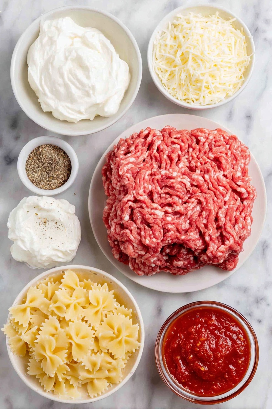 Flat lay of a mound of fresh lean ground beef, a block of softened cream cheese on a simple white ceramic plate, a small white bowl of sour cream, a small white bowl of ricotta cheese, a small white bowl containing mixed Italian seasoning and garlic powder, a small white bowl filled with rich marinara sauce, a simple white ceramic plate with uncooked bowtie (farfalle) pasta, a small white bowl of shredded mozzarella cheese, and a small white bowl of clear water, all ingredients fresh and natural, placed on a clean white marble surface, soft natural light, photo taken with an iPhone, professional food photography style, fresh ingredients, white ceramic bowls, no bottles, no duplicates, no utensils, no packaging --ar 2:3 --v 7 --p awthu7i m7354615311229779997