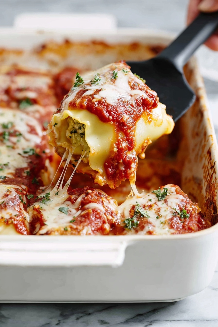 This image shows a white baking dish filled with layers of rolled pasta covered in red tomato sauce and melted white cheese. A woman's hand is lifting one roll with a black spatula, revealing soft pasta wrapped around a light filling. The tomato sauce on top is thick and chunky, with bits of green herbs sprinkled over the cheese. The cheese is melted and stretchy, with strands pulling from the roll being lifted. The edges of the dish have some sauce smudges, and the background is a white marbled surface. photo taken with an iphone --ar 2:3 --v 7