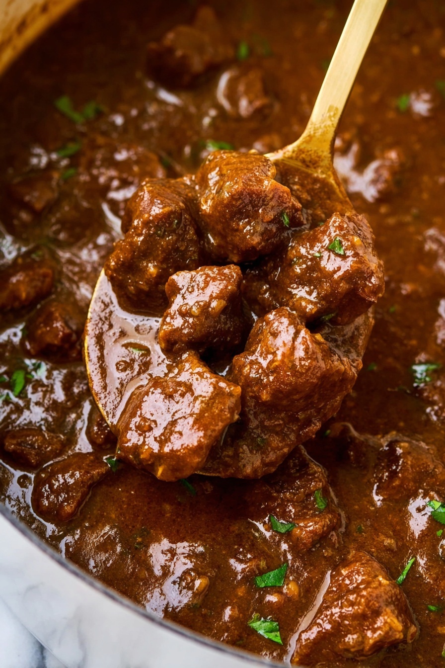 The image shows a close-up of a rich brown stew with thick gravy, filled with tender, chunky pieces of meat coated in the sauce. The stew has small bits of green herbs scattered throughout, adding a touch of color contrast. A wooden spoon is lifting a portion of the stew, holding several large chunks of meat that glisten under the light, highlighting the smooth and shiny texture of the sauce. The background features the same stew, giving a sense of depth and fullness. The overall color palette is deep brown with subtle green accents on a white marbled surface. Photo taken with an iphone --ar 2:3 --v 7