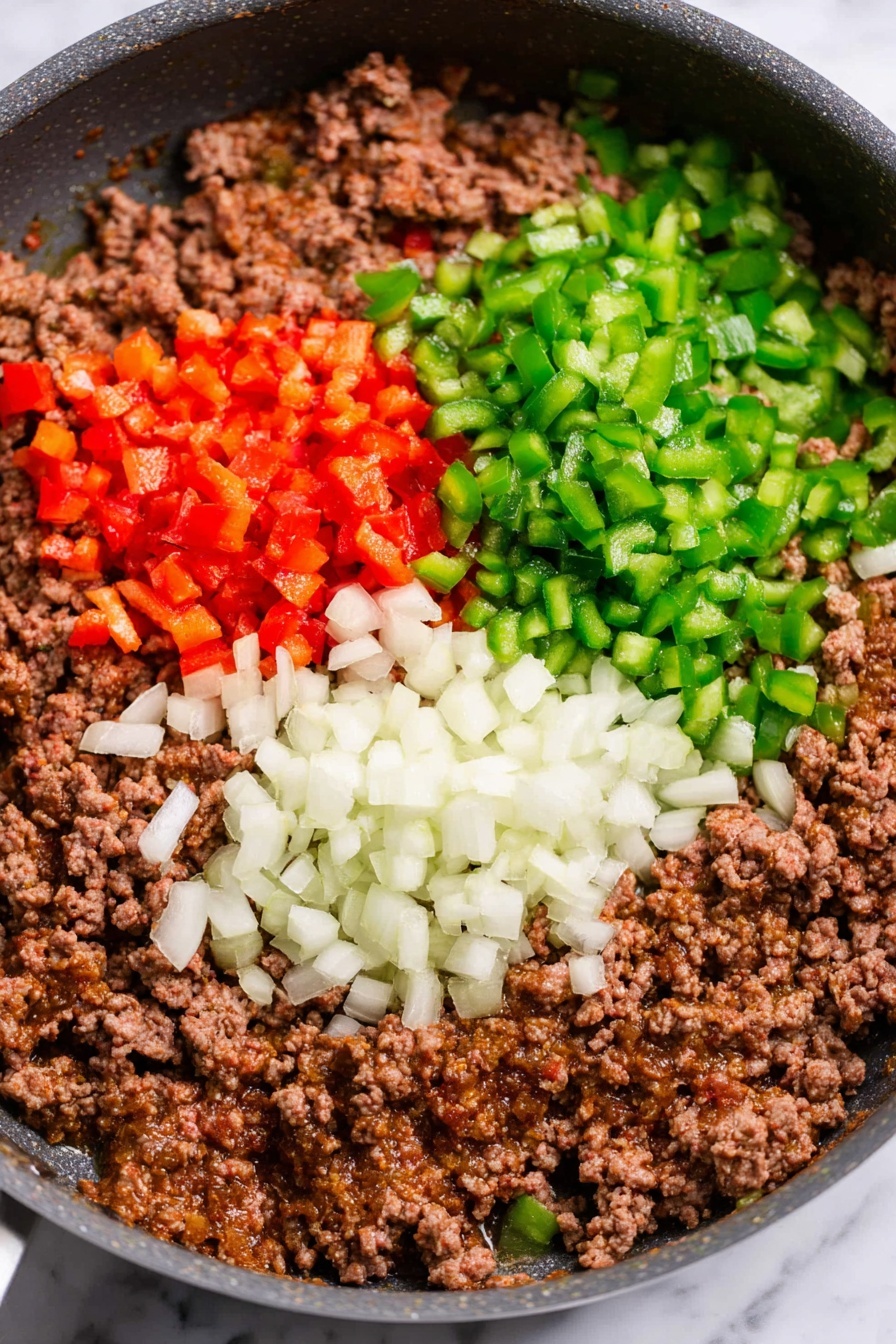 A close-up image of a bowl filled with a creamy layered dish that has about three distinct layers: a base layer of light yellow cooked potato slices, a middle layer of ground meat mixed with small pieces of red and green bell peppers, and a top layer of melted, bubbly orange and white cheese with some browned spots. The dish has a slightly lumpy texture with some green herbs sprinkled on top, and there is a silver spoon resting inside the bowl. The bowl is white with a speckled pattern, and it sits on a white marbled surface next to a striped cloth. Photo taken with an iphone --ar 2:3 --v 7