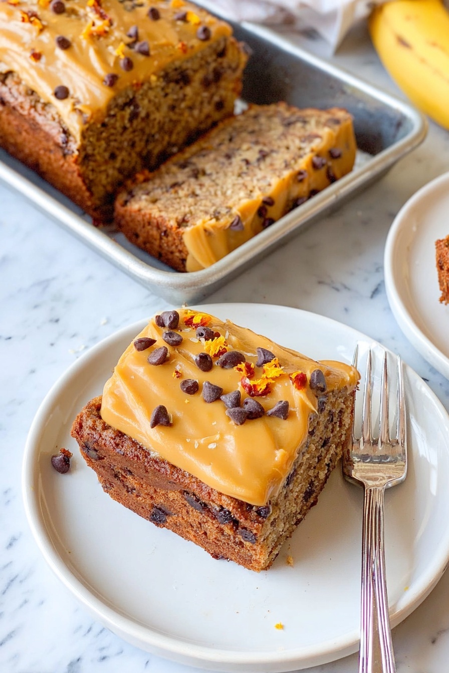 The image shows a single deep rectangular white baking dish filled with light golden batter mixed with small dark chocolate chips scattered throughout. The batter looks smooth with some shiny spots and slight unevenness on the surface, creating gentle waves and texture. The white marbled surface underneath adds contrast to the dish. photo taken with an iphone --ar 2:3 --v 7